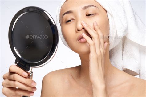 Asian Woman Naked Shoulders Touching Her Face With Her Hand Stock Photo