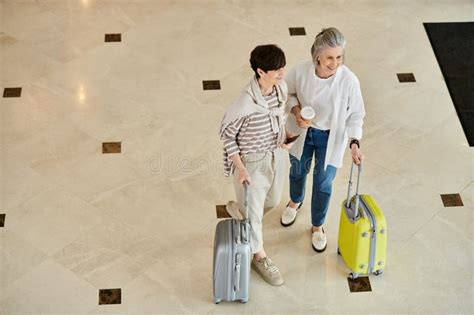 Senior Lesbian Couple Standing With Luggage Stock Photo Image Of Trip Baggage