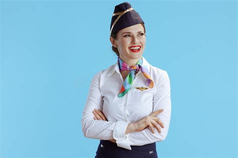 Happy Flight Attendant Woman On Blue Looking At Copy Space Stock Image