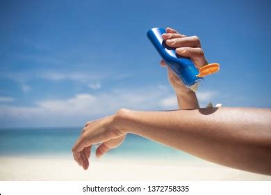 Woman Applying Sunscreen On Her Hands Stock Photo Shutterstock