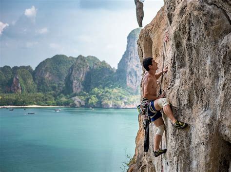 HD Wallpaper Man Wearing Brown Shirt Mountain Climbing At Daytime Man