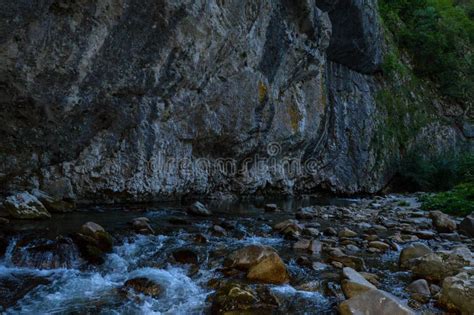 Pristine Natural Landscape With River Flowing Freely Through The Eroded