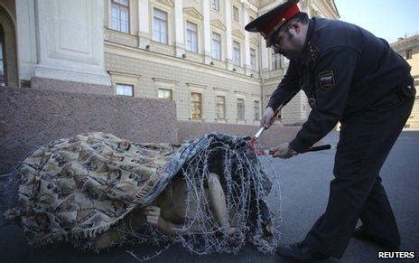 Naked Artist Nails Himself To Red Square In Protest BBC News