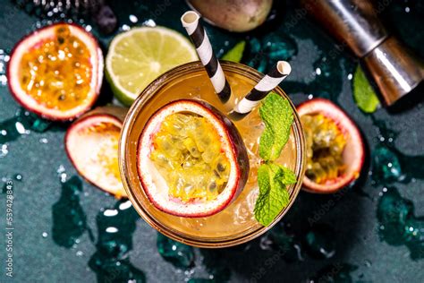 Sweet Colorful Tropical Cocktail With Passion Fruit Lime And Mint