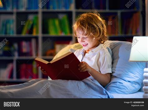 Child Reading Book Bed Image & Photo (Free Trial) | Bigstock