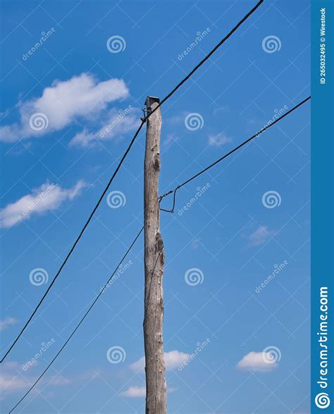 Wooden Pole With Electric Wires Against Blue Sky Background Stock Image