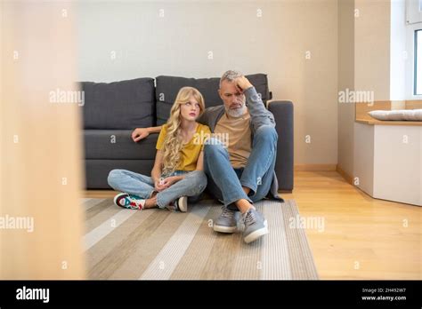 A Blonde Girl Sharing Her Bad Mood With Her Dad Stock Photo Alamy