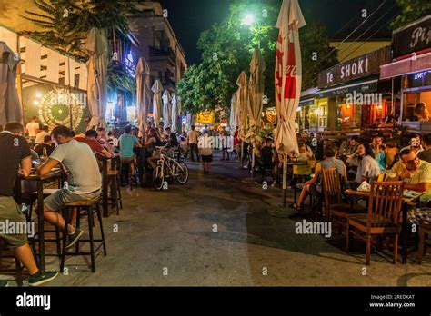 PRISTINA, KOSOVO - AUGUST 12, 2019: People in bars in the center of ...