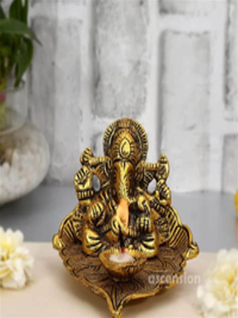 Buy Ascension Gold Toned Lord Ganesha On Leaf With Diya Idol Showpiece