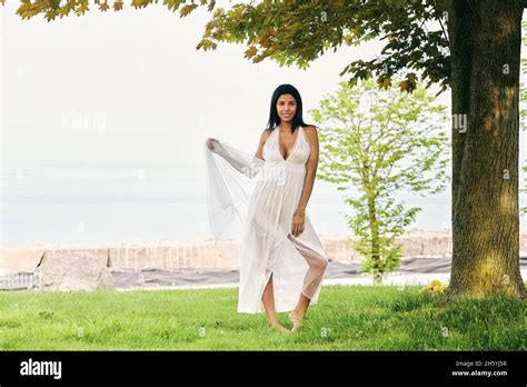 Taking A Break From The Chaos Dark Skinned Latina Woman Finds Solace In A Walk By The Lake