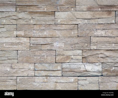 Detailed beige natural stone building material texture Stock Photo - Alamy