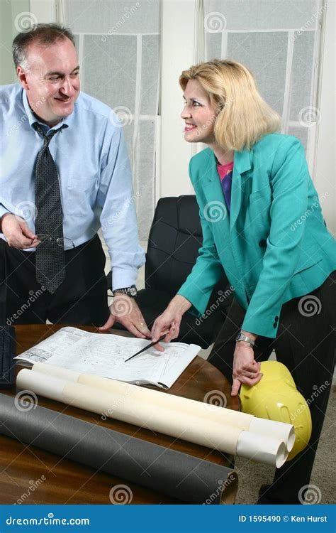 Architect And Client Looking At Blueprints 7 Stock Photo Image Of