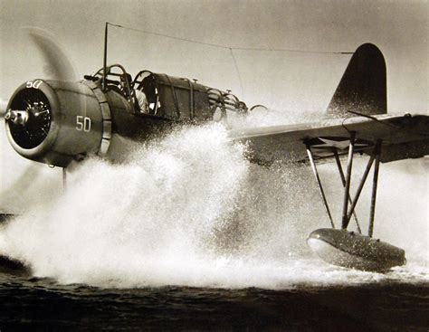 Navy Observation Scout Plane Comes Down In A Cloud Of Spray At An East