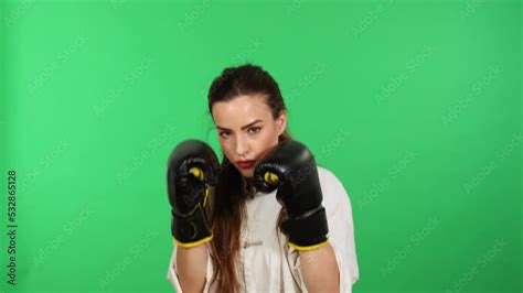 Beautiful Long Hair Brunette Woman Wearing Boxing Gloves And Dressed In Wushu Martial Arts