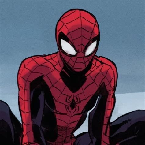 A Spider Man Sitting On The Ground With His Eyes Wide Open In Front