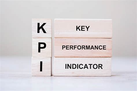 Premium Photo Wooden Cube Block With Kpi Key Performance And Indicator