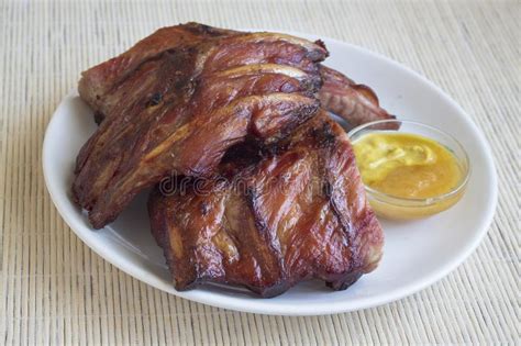 Smoked Roasted Pork Ribs And Sauce Of Honey With Ginger And Mustard