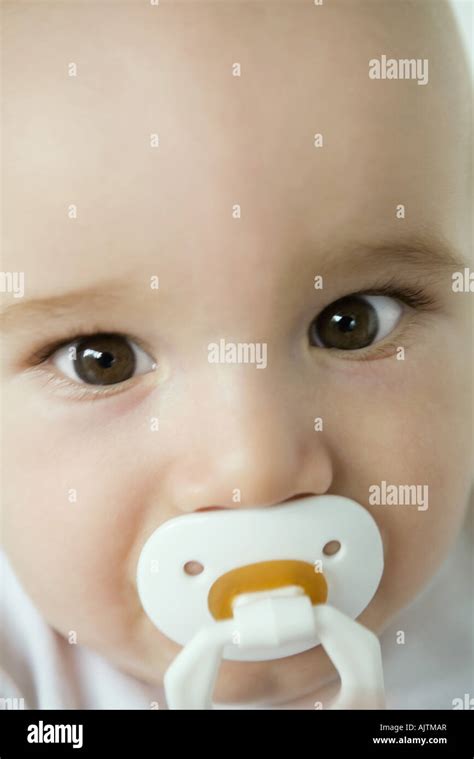 Baby With Pacifier In Mouth Close Up Stock Photo Alamy