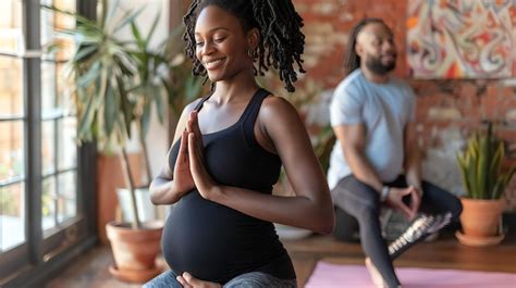 Premium Photo Expecting Mother Practicing Yoga With Her Partner At