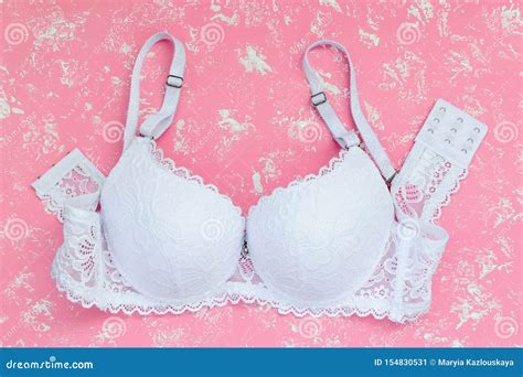 White Lace Bra On A Pastel Pink Background With White Spots Comfortable Modern Lingerie And
