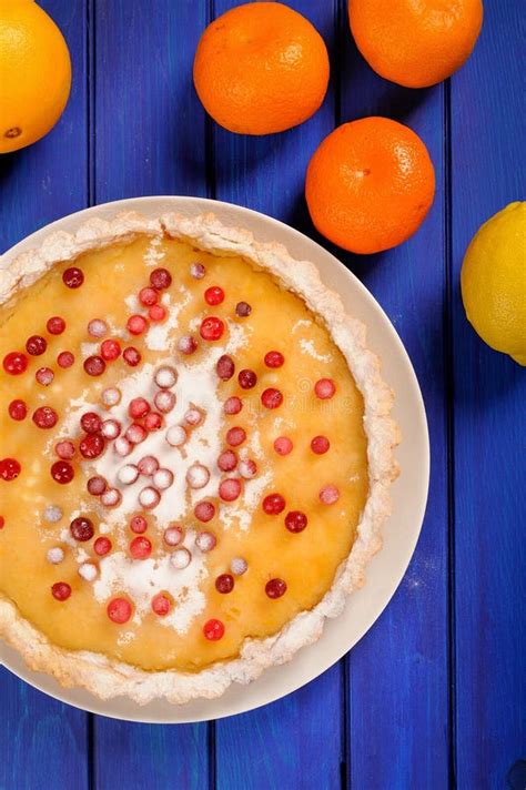 Homemade Lemon Pie Decorated With Fresh Cranberries And Icing Sugar