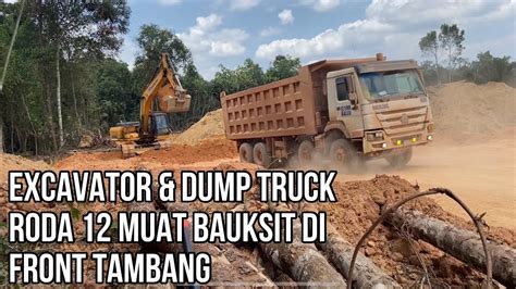 Excavator Dump Truck Besar Roda 12 Muat Bauksite Di Front Tambang