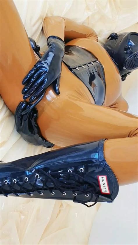 Anal Only Latex Catsuit With An Integrated Condom The Inflatable Plug Has Been Pushed All The