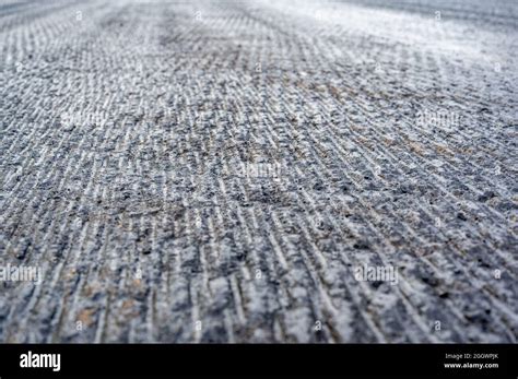 Top View Of Scarified And Grooved Concrete On A City Road For Overlay