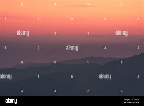 Sunset sky over mountain ridge Stock Photo - Alamy