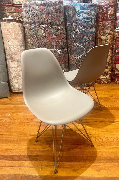 Iconic Pair Molded Plastic Chairs Designed By Charles Eames For Herman