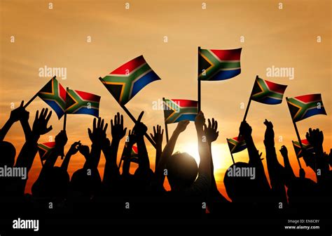 Group Of People Waving South African Flags In Back Lit Stock Photo Alamy