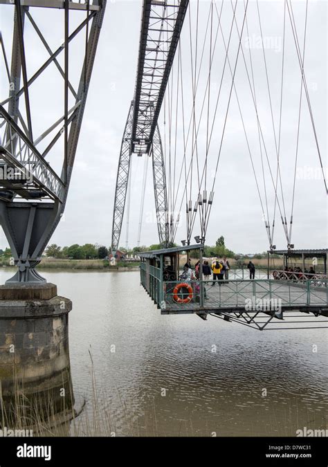 A view of the historic Transporter bridge crossing the Charente river in Rochefort, France Stock ...