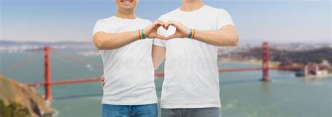 Couple With Gay Pride Rainbow Wristbands And Heart Stock Photo Image