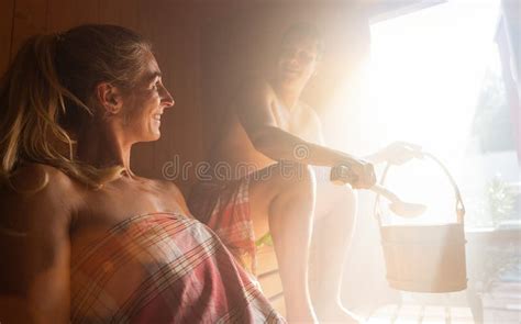 Two People A Couple Enjoying A Hot Sauna Having A Casual Conversation Stock Photo Image