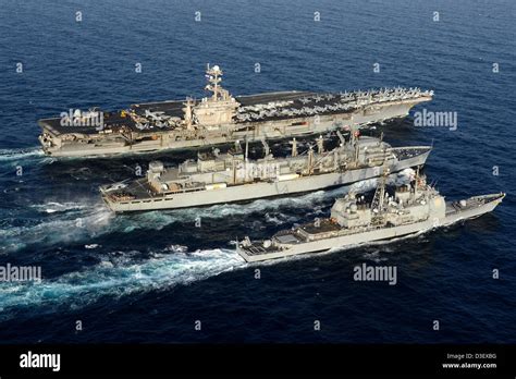 Aerial view of the aircraft carrier USS John C. Stennis and guided ...