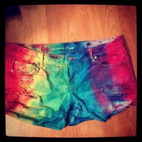 A Pair Of Colorful Shorts Sitting On Top Of A Wooden Floor