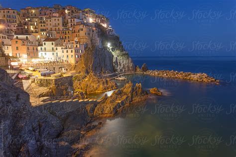 "Manarola By Night" by Stocksy Contributor "Marcin Sobas" - Stocksy