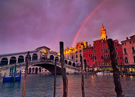 A Rainbow Over The 15th Century Rialto Bridge In Venice Italia Shot