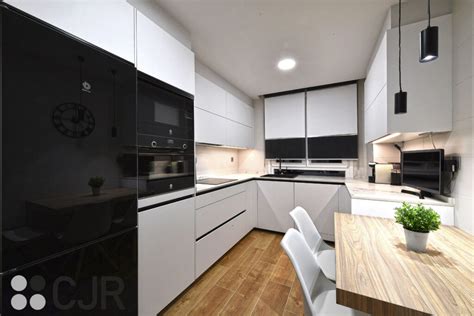 Cocina pequeña blanca dekton kairos en U con mesa CJR Cocinas CJR Santos