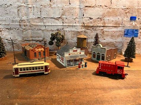 Lionel Village Buildings & Locomotive - Trice Auctions