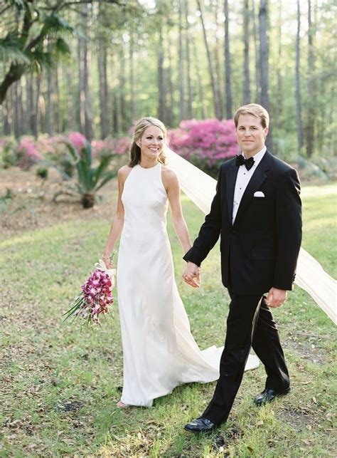 Camera Eubanks And Dr Jason Wimberly Holding Hangs In Wedding Dress