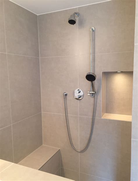 The Shower Head Is Mounted To The Wall