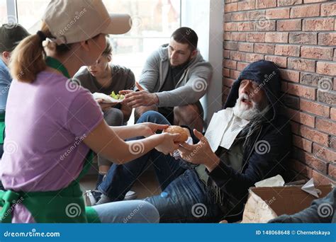 Volunteer Giving Food To Poor Senior Man Stock Photo Image Of Mature