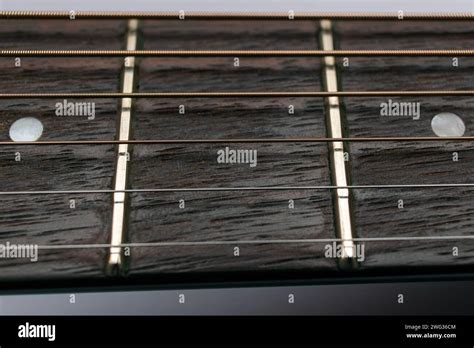 Acoustic Guitar Fretboard Close Up With Strings Wooden Brass Frets