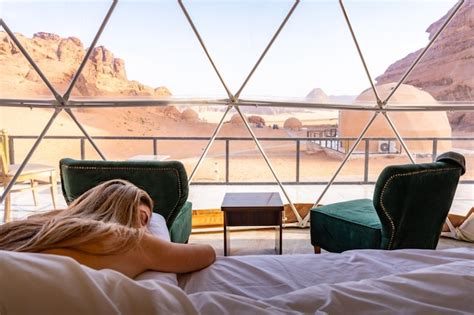 Premium Photo Naked Tourist Woman With Long Blonde Hair In Sleeping Into Bubble Tent At Wadi