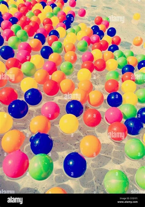 Colorful Plastic Balls Floating On Water Stock Photo Alamy