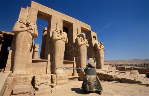 Photos and pictures of: The Ramesseum, temple of Rameses II, Osiris pillars and colossal head of ...