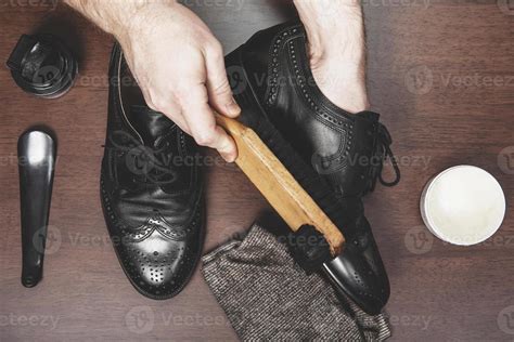 Polishing leather shoes 1261599 Stock Photo at Vecteezy