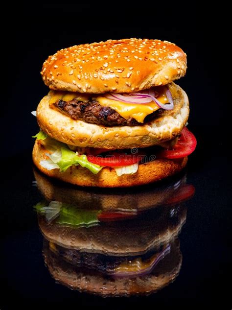 Meat and Cheese Burger on a Black Background Stock Image - Image of background, restaurant ...