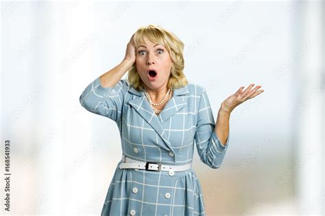 Surprised White Skin Lady On White Background Mature Blonde Touching Her Head Looking Surprised